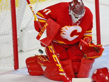 The winning Montreal Canadiens goal slips between the pads of Calgary Flames goaltender Mike Smith during NHL hockey action at the Scotiabank Saddledome in Calgary on Thursday November 15, 2018. The Habs won 3-2.