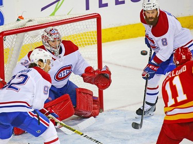 Montreal Canadiens goaltender Carey Price tracks a flying puck during NHL hockey action against the Calgary Flames at the Scotiabank Saddledome in Calgary on Thursday November 15, 2018.