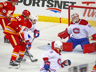 Montreal Canadiens goaltender Carey Price stops this Calgary Flames scoring chance during NHL action at the Scotiabank Saddledome in Calgary on Thursday November 15, 2018.