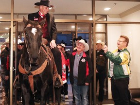 Phil Langdon with the Calgary Grey Cup Committee continues a long running Grey Cup tradition riding Tuffy the horse into the Chateau Lacombe Hotel in Edmonton  on Thursday Nov. 22, 2018.