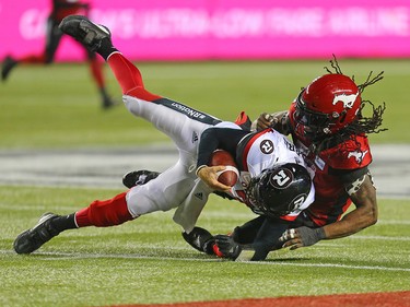 The Calgary Stampeders' Junior Turner sacks Ottawa Redblacks quarterback Trevor Harris during Grey Cup action against the Ottawa Redblacks at Commonwealth Stadium in Edmonton on Sunday November 25, 2018.