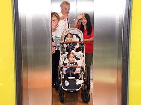 Formerly conjoined Bhutanese twins fifteen-month-old Nima and Dawa and their mother Bhumchu Zangmo (R) leave the Royal Children's Hospital in Melbourne on Nov. 26, 2018.