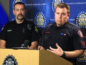 Calgary Const. Kevin Anderson speaks at a press conference on retail crime as Lethbridge police Const. Shawn Davis looks on. Calgary police have joined forces with other Alberta communities to fight retail crime.