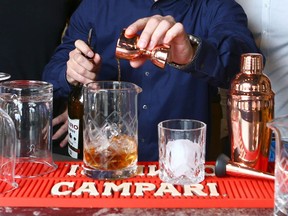 Jeff Jamieson makes a Manhattan beverage at Proof on 1 St SW in downtown Calgary on Tuesday, April 10, 2018. Jim Wells/Postmedia