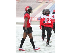 Stamps Markeith Ambles (L) shows off bare legs while others were bundled up in the cold during practice at McMahon Stadium in Calgary on Friday, November 16, 2018. The Stampeders play Winnipeg Blue Bombers in the CFL Western Final on Sunday in Calgary. Jim Wells/Postmedia