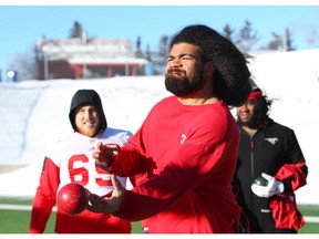 Offensive lineman Nila Kasitati shows off his best bocce ball skills with other lineman following a light practice at McMahon Stadium in Calgary on Saturday, November 17, 2018. The Stampeders host the Winnipeg Blue Bombers in the CFL Western Final on Sunday. Jim Wells/Postmedia