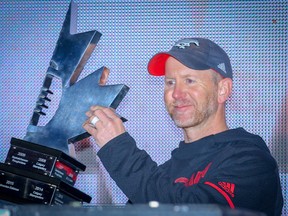 Calgary Stampeders head coach Dave Dickenson with the west final trophy after defeating the Winnipeg Blue Bombers in the 2018 CFL Western Final in Calgary on Sunday, November 18, 2018. Al Charest/Postmedia