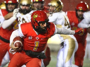 Calgary Dinos Josiah Joseph runs the ball during U Sports Canadian college football action between the University of Calgary Dinos and the Manitoba Bisons on Oct. 12, 2018.