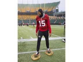Calgary Stampeders wide receiver Eric Rogers (15) jokes around on a pair of snowshoes in Edmonton on Friday. The Ottawa Redblacks will play the Calgary Stampeders in the 106th Grey Cup on Sunday.