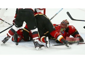 Calgary Flames goaltender Mike Smith makes a save against the Arizona Coyotes during the second period of an NHL hockey game Sunday, Nov. 25, 2018, in Glendale, Ariz. The Flames defeated the Coyotes 6-1.