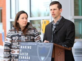 Eddie Maurice, with his wife Jessica, speaks to media about the rise of rural crime in Alberta at a press conference in Okotoks on Monday, Nov. 26, 2018.