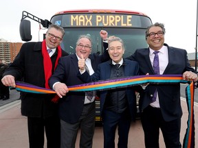 L-R, Director of Calgary Transit, Doug Morgan, Alberta Minister of Transportation & Government House Leader, Brian Mason, Federal Minister of Infrastructure & Communities, Hon. Francois-Philippe Champagne and Calgary Mayor Naheed Nenshi cheer on the three new MAX lines that will open for service on Monday at the new 33 St. SE station platform MAX Purple in Calgary on Thursday November 15, 2018. Darren Makowichuk/Postmedia