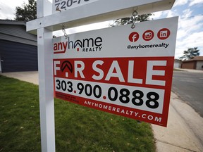 FILE- In this Oct 2, 2018, file photo a for sale sign stands outside a home on the market in the north Denver suburb of Thornton, Colo. On Wednesday, Nov. 21, Freddie Mac reports on this weekís average U.S. mortgage rates. (AP Photo/David Zalubowski, File) ORG XMIT: NYBZ301