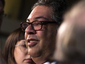 Calgary Mayor Naheed Nenshi speaks with media at city hall on Monday, Nov. 19, 2018, after council voted to end the 2026 Winter Olympic bid.