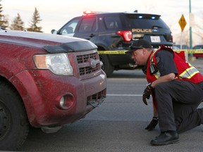 Calgary police investigate a serious accident involving a suv and a pedestrian at the intersection of Bow Trail and 37str. S.W. on Thursday November 22, 2018. Darren Makowichuk/Postmedia