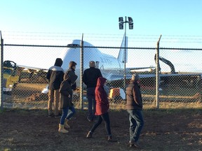 A Boeing 747 cargo jet sits off the runway near the perimeter of Halifax Stanfield International Airport in Halifax, Sunday, Nov. 11, 2018.