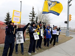 Calgary Postal workers hit the picket lines again at their headquarters in Calgary on Monday, Nov. 5, 2018.