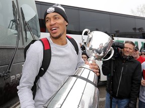 Calgary Stampeders Eric Rogers with the Grey Cup as the team returned to McMahon stadium in Calgary on Monday Nov. 26, 2018.