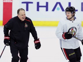 Ottawa Senators assistant coach Martin Raymond (left) shares a laugh with Max McCormick during a Senators team practice in Ottawa on Tuesday, November 6, 2018. THE CANADIAN PRESS/Fred Chartrand