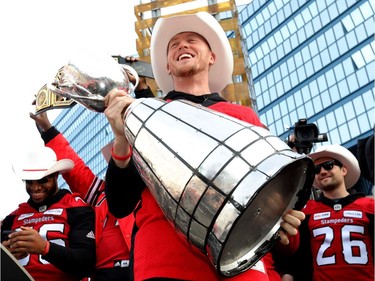 Calgary Stampeders QB, Bo Levi Mitchell with the Grey Cup as thousands of fans turned out for a rally celebrating the Calgary Stampeders victory outside city hall in Calgary on Tuesday, Nov. 27, 2018.