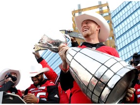 Calgary Stampeders QB, Bo Levi Mitchell with the cup as thousands of fans came out as the City of Calgary held a rally to celebrate the Calgary Stampeders' victory in the 106th Grey Cup, a 27-16 win over the Ottawa RedBlacks in Calgary on Tuesday November 27, 2018. Darren Makowichuk/Postmedia