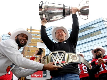 The Calgary Stampeders Head Coach Dave Dickenson with the cup as thousands of fans turned out for a rally celebrating the Calgary Stampeders victory in the 106th Grey Cup outside city hall in Calgary on Tuesday, Nov. 27, 2018.