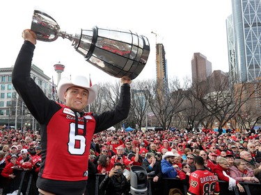 Calgary Stampeders Rob Maver hoists the cup as thousands of fans turned out for a rally celebrating the Calgary Stampeders victory in the 106th Grey Cup outside city hall in Calgary on Tuesday, Nov. 27, 2018.