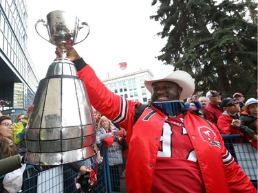 Calgary Stampeders Derek Wiggan with the cup as thousands of fans turned out for a rally celebrating the Calgary Stampeders victory in the 106th Grey Cup outside city hall in Calgary on Tuesday, Nov. 27, 2018.