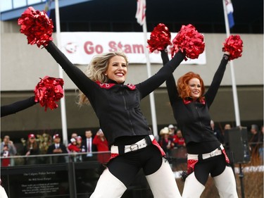 The Calgary Stampeders Outriders perform as thousands of fans turned out for a rally celebrating the Calgary Stampeders victory in the 106th Grey Cup outside city hall in Calgary on Tuesday, Nov. 27, 2018.