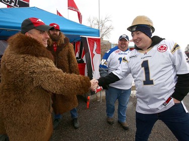 Calgary Stampeder and Winnipeg Blue Bomber fans mix it up during the tailgate party before the CFL Western Final in Calgary at McMahon Stadium on Sunday, November 18, 2018. Jim Wells/Postmedia