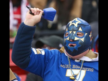 A Winnipeg Blue Bomber fan cheers during the CFL Western Final in Calgary at McMahon Stadium on Sunday, November 18, 2018. Jim Wells/Postmedia