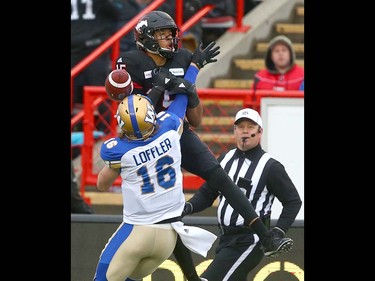Calgary Stampeders Eric Rogers (15) goes up for a pass and is defend ed by Winnipeg Blue Bombers Taylor Loffler during the CFL Western Final in Calgary at McMahon Stadium on Sunday, November 18, 2018. The pass was incomplete.Jim Wells/Postmedia