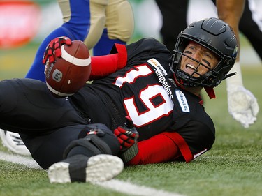 Calgary Stampeders quarterback Bo Levi Mitchell is sacked by Winnipeg Blue Bombers  in the CFL Western Final at McMahon Stadium in Calgary, on Sunday November 18, 2018. Leah hennel/Postmedia