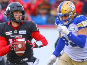 Calgary Stampeders quarterback Bo Levi Mitchell runs with the ball as he looks for an open receiver against the Winnipeg Blue Bombers during the 2018 CFL Western Final  in Calgary on Sunday, November 18, 2018. Al Charest/Postmedia