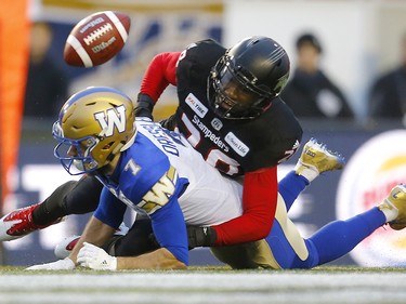 Calgary Stampeders Brandon Smith tackles Winnipeg Blue Bombers Weston Dressler during the CFL Western Final at McMahon Stadium  in Calgary, on Sunday November 18, 2018. Leah hennel/Postmedia