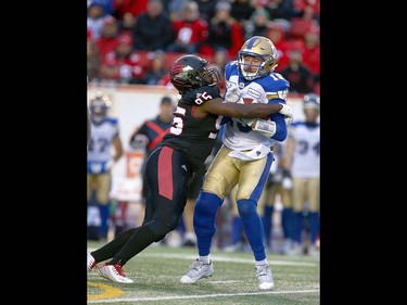 Calgary Stampeders Calgary Stampeders Ja'Gared Davis (L) hits Winnipeg Blue Bomber QB Matt Nichols during the CFL Western Final in Calgary at McMahon Stadium on Sunday, November 18, 2018. Jim Wells/Postmedia