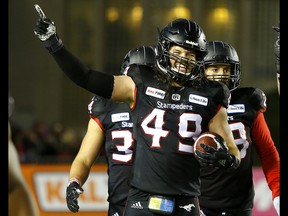 Calgary Stampeders Alex Singleton reacts to their win against the Winnipeg Blue Bombers  in the CFL Western Final at McMahon Stadium  in Calgary, on Sunday November 18, 2018. Leah hennel/Postmedia