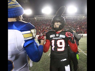 Calgary Stampeders QB Bo Levi Mitchell (R) shakes hads with Winnipeg Blue Bombers QB Matt Nichols after the CFL Western Final in Calgary at McMahon Stadium on Sunday, November 18, 2018. Jim Wells/Postmedia