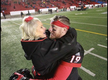 Calgsary QB Bo Levi Mitchell gets a kiss and a greeting from his wife Madi Mitchell after the CFL Western Final in Calgary at McMahon Stadium on Sunday, November 18, 2018. Jim Wells/Postmedia