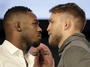 Jon Jones, left, and Alexander Gustafsson face off while posing for a photographers during a news conference talking about their light heavyweight mixed martial arts bout, Friday, Nov. 2, 2018, at Madison Square Garden in New York. The two are to fight in UFC 232, which is scheduled for Dec. 29, 2018, in Las Vegas.