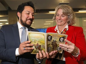L-R, The Honourable Ricardo Miranda, Minister of Culture and Tourism and University of Calgary President Elizabeth Cannon look over archives after announcing the creation of the Glenbow Western Research Centre, moving archives from as far back as the 1800s all the way to the 1990s from the Glenbow Museum to the Taylor Family Digital Library on campus and the high-density library in Spy Hill in Calgary on Wednesday November 14, 2018. Darren Makowichuk/Postmedia