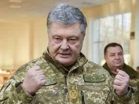 Ukrainian President Petro Poroshenko speak to soldiers during a visit to a military base in Chernihiv region, Ukraine, Wednesday, Nov, 28, 2018. Russia and Ukraine traded blame after Russian border guards on Sunday opened fire on three Ukrainian navy vessels and eventually seized them and their crews. The incident put the two countries on war footing and raised international concern.