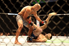 Ryan Hall (right) kicks B.J. Penn (left) during the first round of a Lightweight bout during the UFC 232 event inside The Forum on Dec. 29, 2018 in Inglewood, Calif. (Sean M. Haffey/Getty Images)
