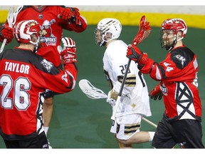 Calgary Roughnecks Dane Dobbie, right, celebrates his goal on Vancouver Warriors with teammates during their game at the Scotiabank Saddledome in Calgary, on Saturday December 15, 2018. Leah Hennel/Postmedia ORG XMIT: POS1812152120072427