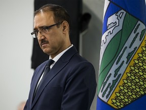 Minister of Natural Resources Amarjeet Sohi stands beside an Alberta provincial flag as he takes part in a press conference where the Federal government announced $1.6 billion in support for Canada's oil and gas sector, at NAIT in Edmonton Tuesday Dec. 18, 2018. Photo by David Bloom