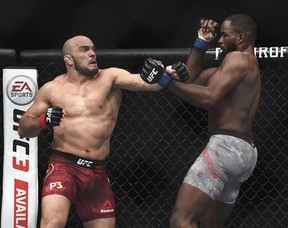 Ilir Latifi, left, throws a punch to Corey Anderson during the first round of a light heavyweight mixed martial arts bout at UFC 232, Saturday, Dec. 29, 2018, in Inglewood, Calif. (AP Photo/Kyusung Gong)
