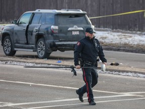 Police investigating after two pedestrians were killed after being struck by a vehicle at the intersection of John Laurie Boulevard and Hawkwood Drive N.W.on Monday, December 24, 2018. Al Charest/Postmedia