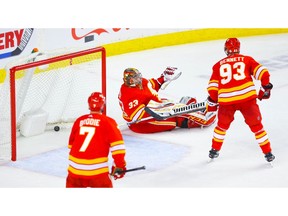Calgary Flames goaltender David Rittich reacts after giving up the overtime goal to the Vancouver Canucks during NHL hockey at the Scotiabank Saddledome in Calgary on Saturday. Photo by Al Charest/Postmedia