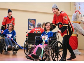 The Calgary Flames, including Sean Monahan, left and James Neal played the Alberta Children's Hospital Townsend Tigers in an annual wheel chair hockey game on Thursday December 13, 2018. For the 38th straight year the Tigers were victorious. Gavin Young/Postmedia