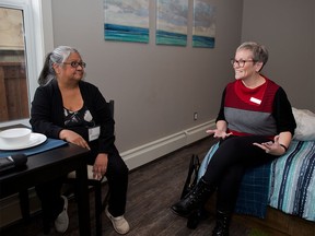 Diane Gautchier , left, with the Calgary Homeless Foundation's Client Action Committee and Diana Krecsy, president and CEO, Calgary Homeless Foundation talk in one of the apartments in the Maple which was officially opened by the HomeSpace Society in Calgary on Tuesday December 18, 2018. The new apartment building in Regal Terrace provides permanent supportive housing for women in Calgary.  Gavin Young/Postmedia